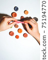 Child's hands close-up with plasticine. 75194770