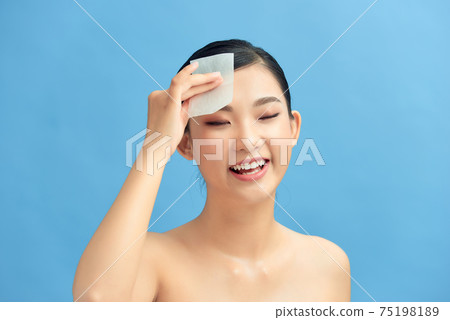 Skin Care. Woman Removing Oil From Face Using Blotting Papers. 75198189