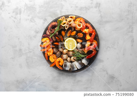Seafood charcuterie board with shrimp, oysters, fish and octopus Seafood charcuterie board with shrimp, oysters, fish and octopus 75199080