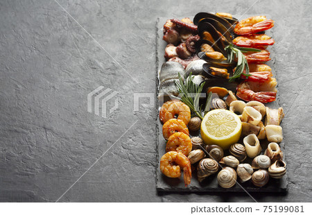 Seafood charcuterie board with shrimp, oysters, fish and octopus Seafood charcuterie board with shrimp, oysters, fish and octopus 75199081