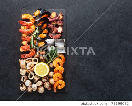 Seafood charcuterie board with shrimp, oysters, fish and octopus Seafood charcuterie board with shrimp, oysters, fish and octopus 75199082