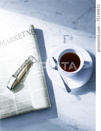 Newspaper and coffee cup 75199472