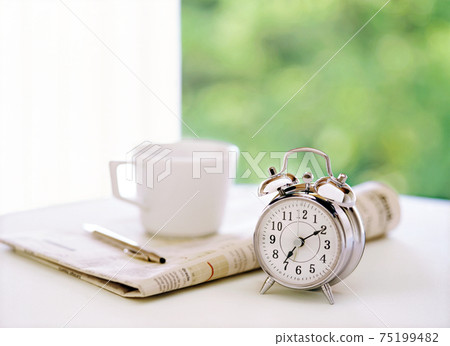 Alarm clock, newspaper and coffee Alarm clock, newspaper and coffee 75199482