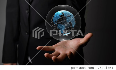 Human hand holding earth globe holographic technology 75201764