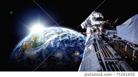 Astronaut spaceman do spacewalk while working for space station 75201850