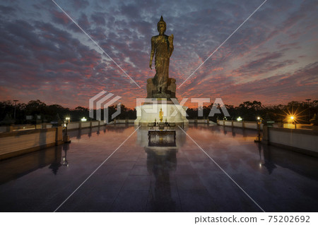 Buddhism Ceremony, Candlelight light trails of people walking around the church in Magha Puja Day, Important day in buddha religion at Phutthamonthon park, Nakhon Pathom. 75202692