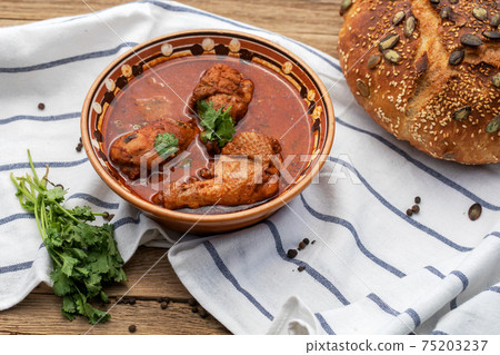 Chakhokhbili chicken Georgian cuisine wooden background 75203237