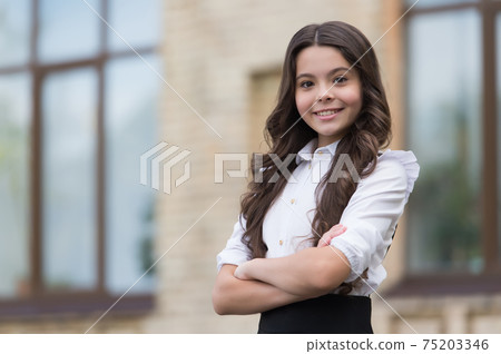 Little but confident. Little child keep arms crossed  75203346