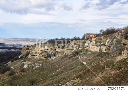 view of the ruins of an ancient cave city-fortress Chufut-Kale, Crimea 75203571