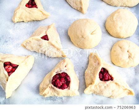 handmade sweet buns filled by fresh raspberries handmade sweet buns filled by fresh raspberries 75206963