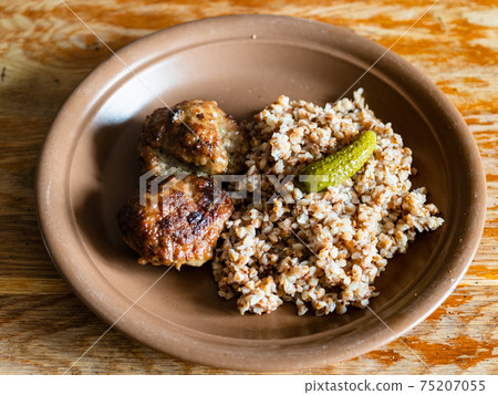 russian Kotleta with buckwheat porridge on plate 75207055