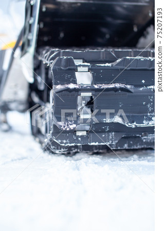 Rear suspension of a snowmobile in winter. Riding in the snow 75207193