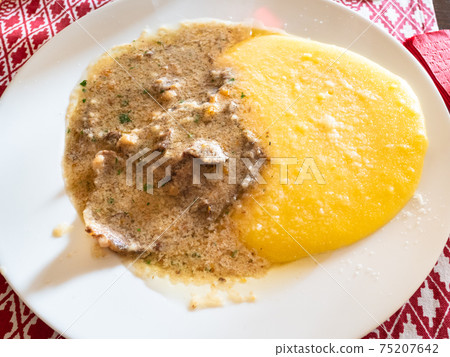 top view of Manzo all'Olio with polenta on plate top view of Manzo all'Olio with polenta on plate 75207642