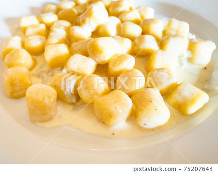 gnocchi with sauce from Gorgonzola cheese close up gnocchi with sauce from Gorgonzola cheese close up 75207643