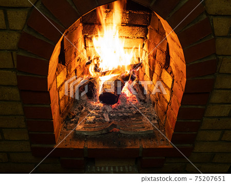 above view of burning firewood in fireplace above view of burning firewood in fireplace 75207651