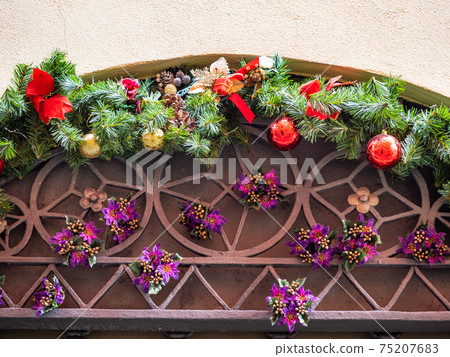 outdoor advent wreath over door on street 75207683