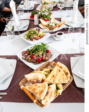 served table at beginning of festive lunch served table at beginning of festive lunch 75208211