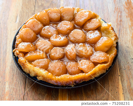 apple pie Tarte Tatin on shabby wooden table 75208231