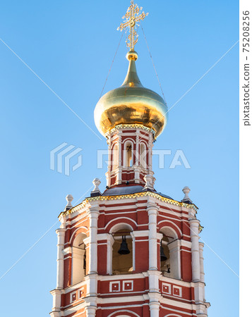 bell tower of Church lit by morning sun in Moscow 75208256