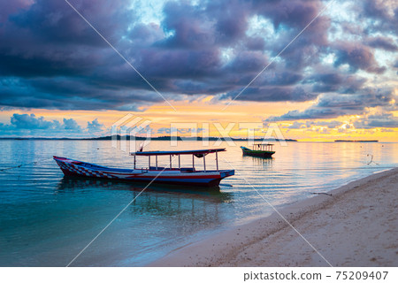 Sunset colorful sky on sea, tropical desert beach, no people, dramatic clouds, travel destination getting away, long exposure Indonesia Sumatra Banyak Islands 75209407
