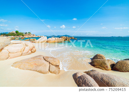 Gorgeous tropical beach turquoise transparent water unique rock boulders, Cam Ranh Nha Trang Vietnam south east coast travel destination, desert beach no people clear blue sky 75209415