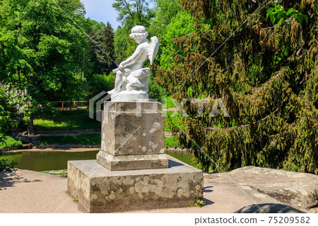 Statue of Cupid in Sofiyivka park in Uman, Ukraine Statue of Cupid in Sofiyivka park in Uman, Ukraine 75209582