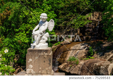 Statue of Cupid in Sofiyivka park in Uman, Ukraine Statue of Cupid in Sofiyivka park in Uman, Ukraine 75209583