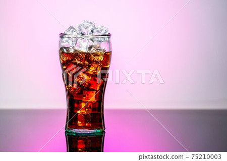 Original glass of Coca Cola with ice and Coca Cola. UK, England, March 3, 2021 Original glass of Coca Cola with ice and Coca Cola. UK, England, March 3, 2021 75210003