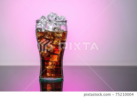 Original glass of Coca Cola with ice and Coca Cola. UK, England, March 3, 2021 Original glass of Coca Cola with ice and Coca Cola. UK, England, March 3, 2021 75210004