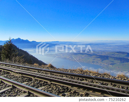 View over the cog railroad to mount Rigi, Switzerland, towards lake Lucerne View over the cog railroad to mount Rigi, Switzerland, towards lake Lucerne 75210262