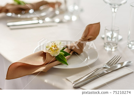 Beautiful decoration of the wedding holiday with flowers and greenery with florist decoration Beautiful decoration of the wedding holiday with flowers and greenery with florist decoration 75210274