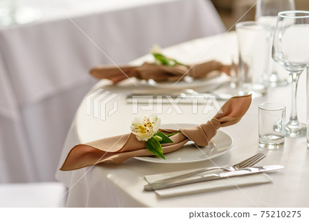 Beautiful decoration of the wedding holiday with flowers and greenery with florist decoration 75210275