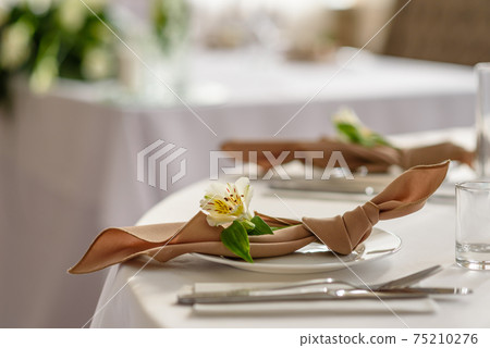 Beautiful decoration of the wedding holiday with flowers and greenery with florist decoration 75210276