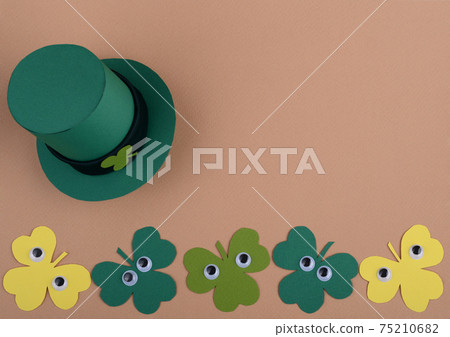 St Patricks Day leprechaun hat and clover leaves with cartoon plastic eyes. St Patricks Day leprechaun hat and clover leaves with cartoon plastic eyes. 75210682