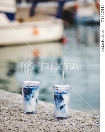 Blue iced matcha latte drink in glasses on 75212412