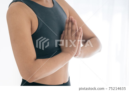 Image of a woman doing yoga Image of a woman doing yoga 75214635