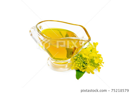 Oil mustard in gravy boat with flower Oil mustard in gravy boat with flower 75218579
