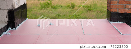 Construction foam between pink extruded styrofoam sheets Construction foam between pink extruded styrofoam sheets 75223800