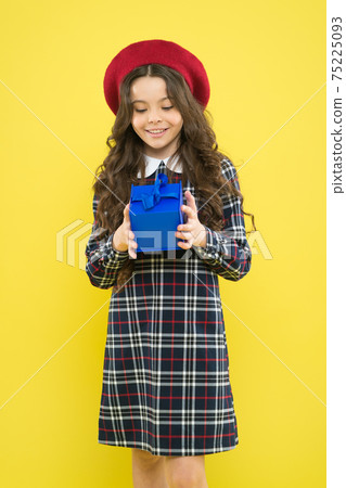 happy girl with long curly hair in beret. shopping. child 75225093