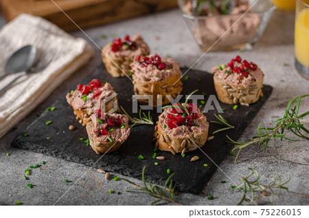 Homemade pate on heathy bread with cranberries Homemade pate on heathy bread with cranberries 75226015