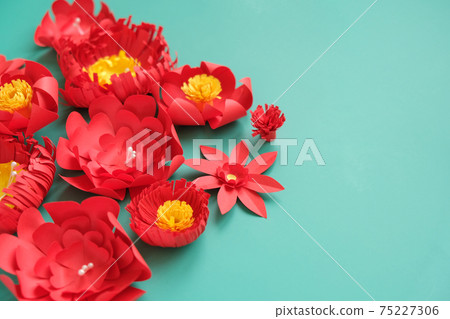 Hello, spring. With red paper flowers and green leaves 75227306