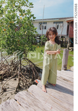 little girl in dress standing and posing little girl in dress standing and posing 75229988