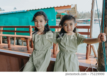 Portrait of Two little girls in beautiful dresses 75229990