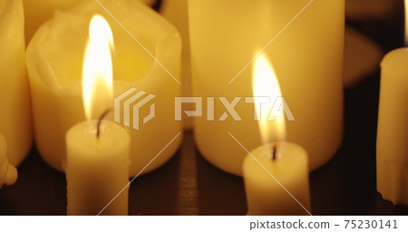 Candles on table closeup photo Candles on table closeup photo 75230141