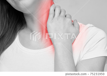 The person is massaging the neck due to muscle strain pain and fatigue. The person is massaging the neck due to muscle strain pain and fatigue. 75231950