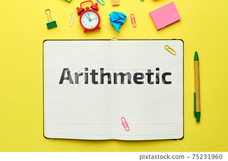 Concept of teaching program in arithmetic in notebook with top view Concept of teaching program in arithmetic in notebook with top view 75231960