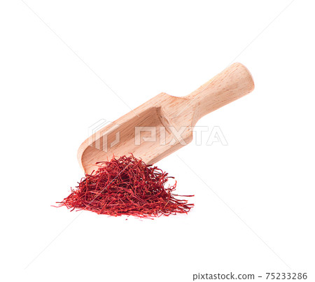 Saffron thread in the wooden bowl, isolated on white background Saffron thread in the wooden bowl, isolated on white background 75233286