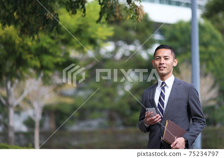 Suit, watch, office worker, new employee, worker, business, outdoor, young man, building, corona, sales copy space Suit, watch, office worker, new employee, worker, business, outdoor, young man, building, corona, sales copy space 75234797