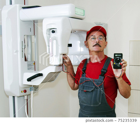 The technician repairs Digital Panoramic X-ray Sistem The technician repairs Digital Panoramic X-ray Sistem 75235339