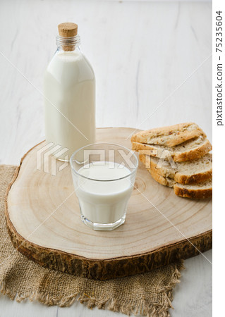 Bottle and a glass of milk Bottle and a glass of milk 75235604